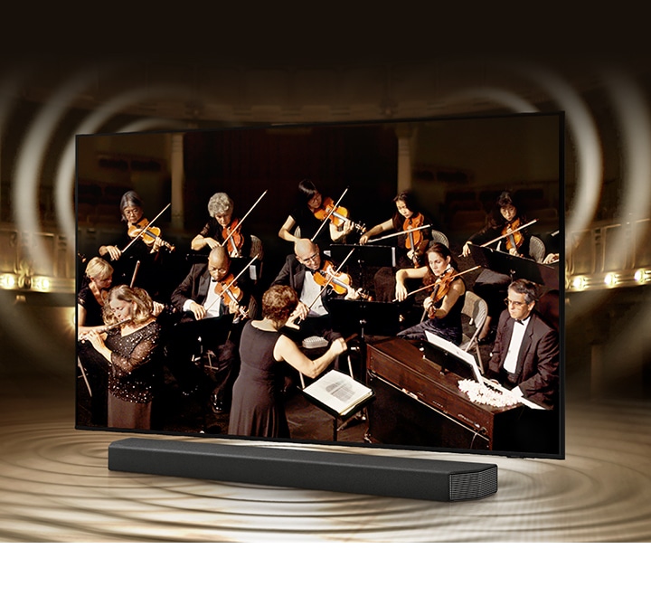 Simulated sound wave graphics from TV and soundbar demonstrate Q Symphony technology as they play sound together.