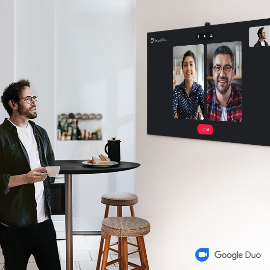 A man is having a video call with 2 other people via Google Duo.