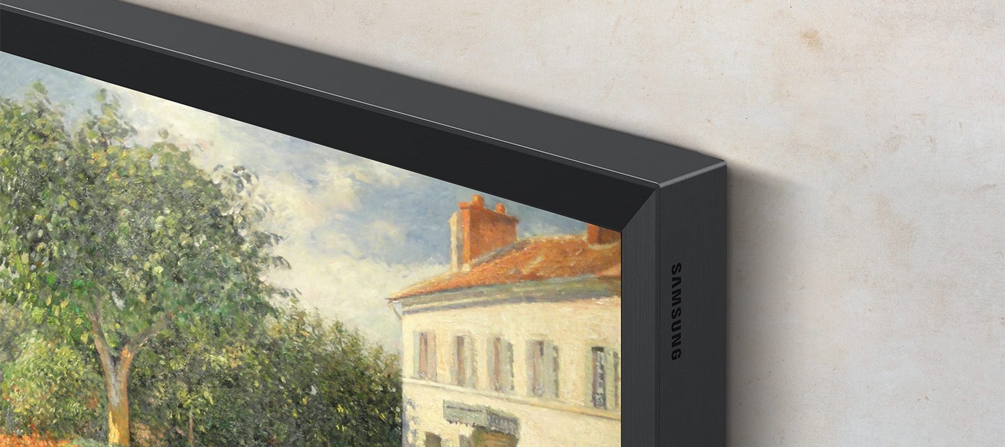 A close-up on a corner of a TV with the metal frame design, which makes it look like a picture frame as it displays artwork.