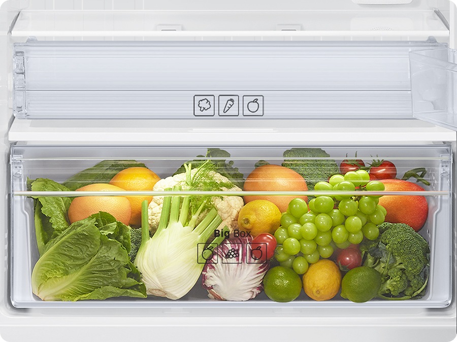 A lot of vegetables and fruits are stored in the veg box.