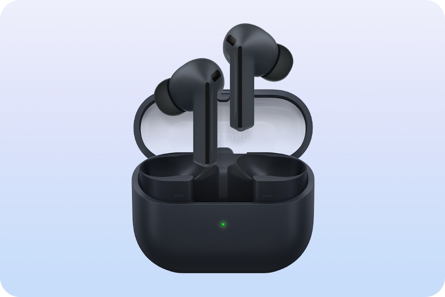 A pair of Black Galaxy Buds3 FE earbuds hovering above the open Galaxy Buds3 FE case.