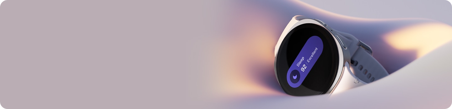 Galaxy Watch8 is resting on soft fabric, with its screen showing a sleep icon, Sleep score of 92 and the word Excellent.