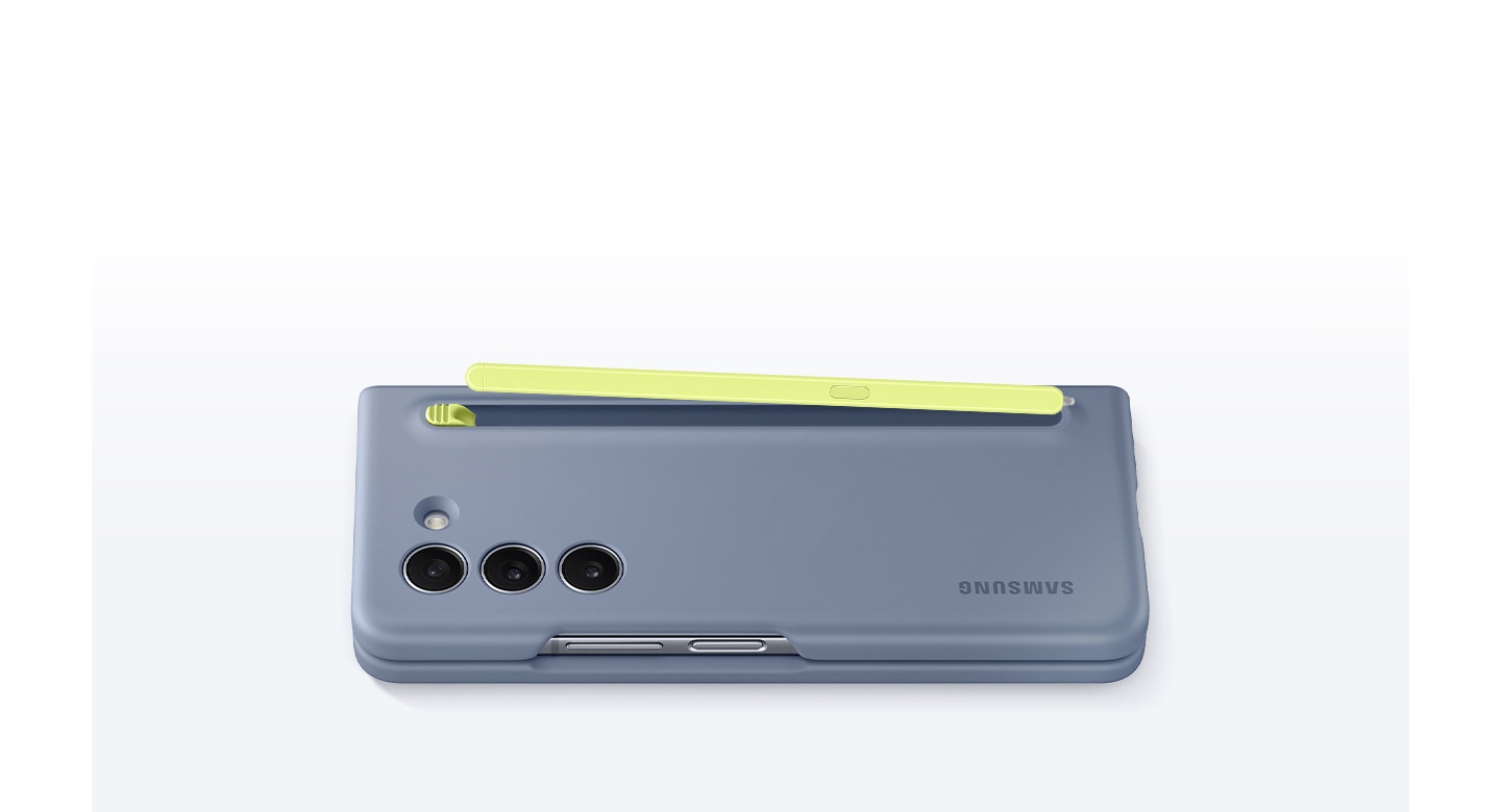 A Galaxy Z Fold5 device encased with an icy blue Slim S Pen Case is lying facing down. The S Pen Case inserted on its back pops out when the button on top is pushed down.