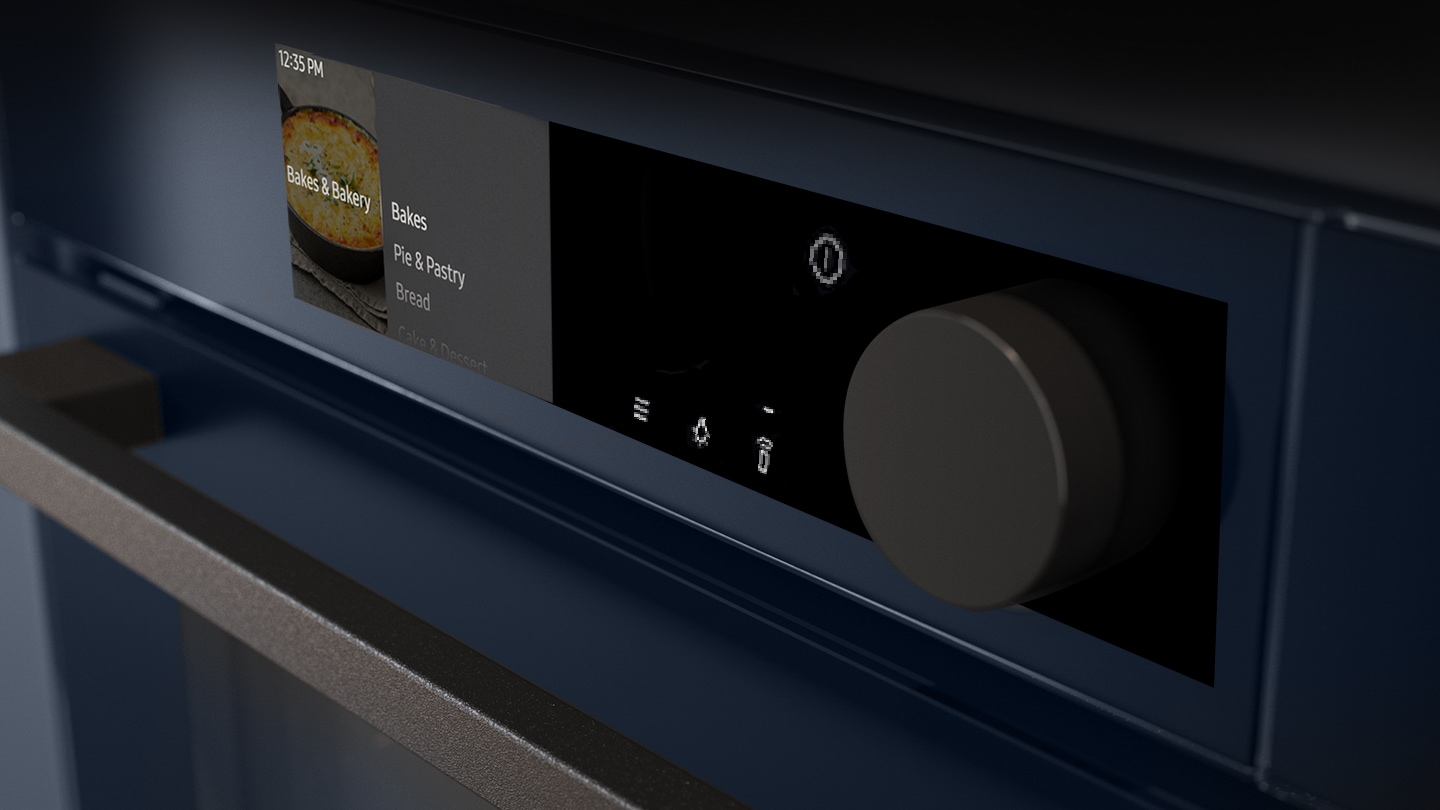 Shows a close-up of the oven's stylishly minimalist control panel with an LCD display, which shows pictures of the various cooking options, touch control and a single knob.