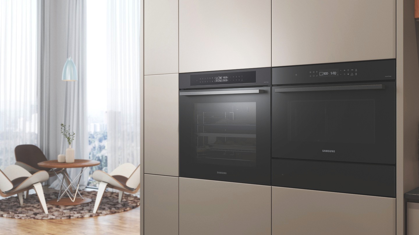 Shows the built-in oven installed in a kitchen, with two cooking zones and a hinged door, next to a Microwave Combi oven.