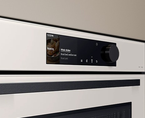 Shows a close-up of the oven's stylishly minimalist control panel with an LCD display, touch control and a single knob.