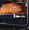 Shows a large roast turkey sliding out of the oven on the Telescopic Rail.