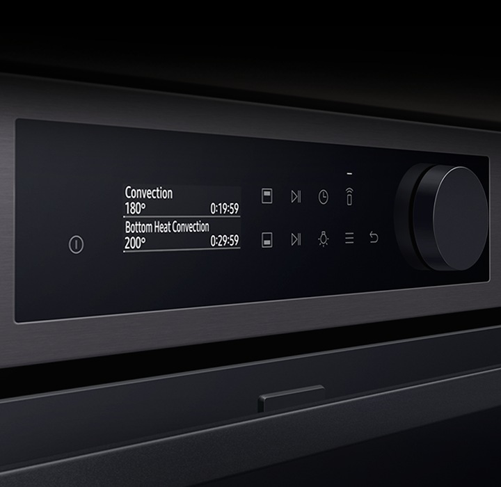 Shows a close-up of the oven's stylishly minimalist control panel with an LCD display, touch control and a single knob.