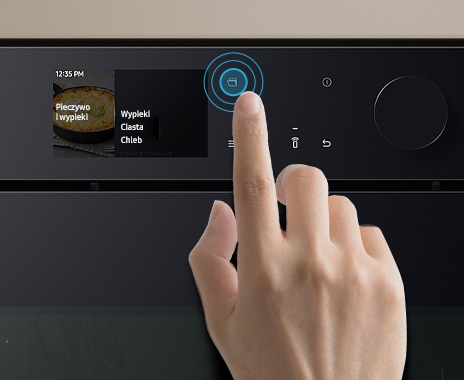 Shows a close-up of a hand touching the Auto Open Door button on the control panel.