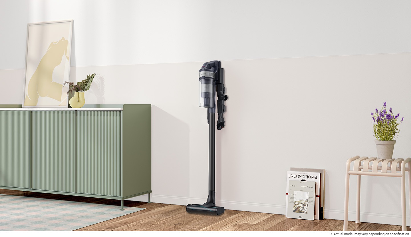 Jet 75E is standing in charging station on the wall of a modern living room.  Actual model may vary depending on specification.