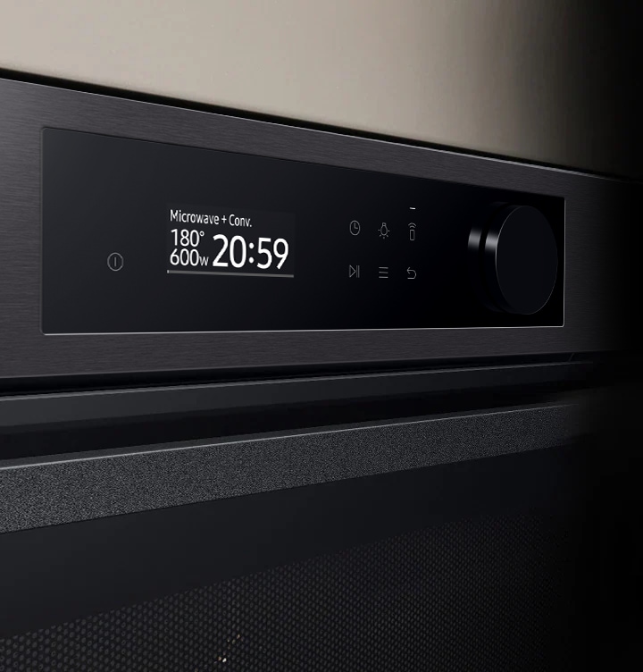 Shows a close-up of the oven's stylishly minimalist control panel with an LCD display, which shows pictures of the various cooking options, touch control and a single knob.
