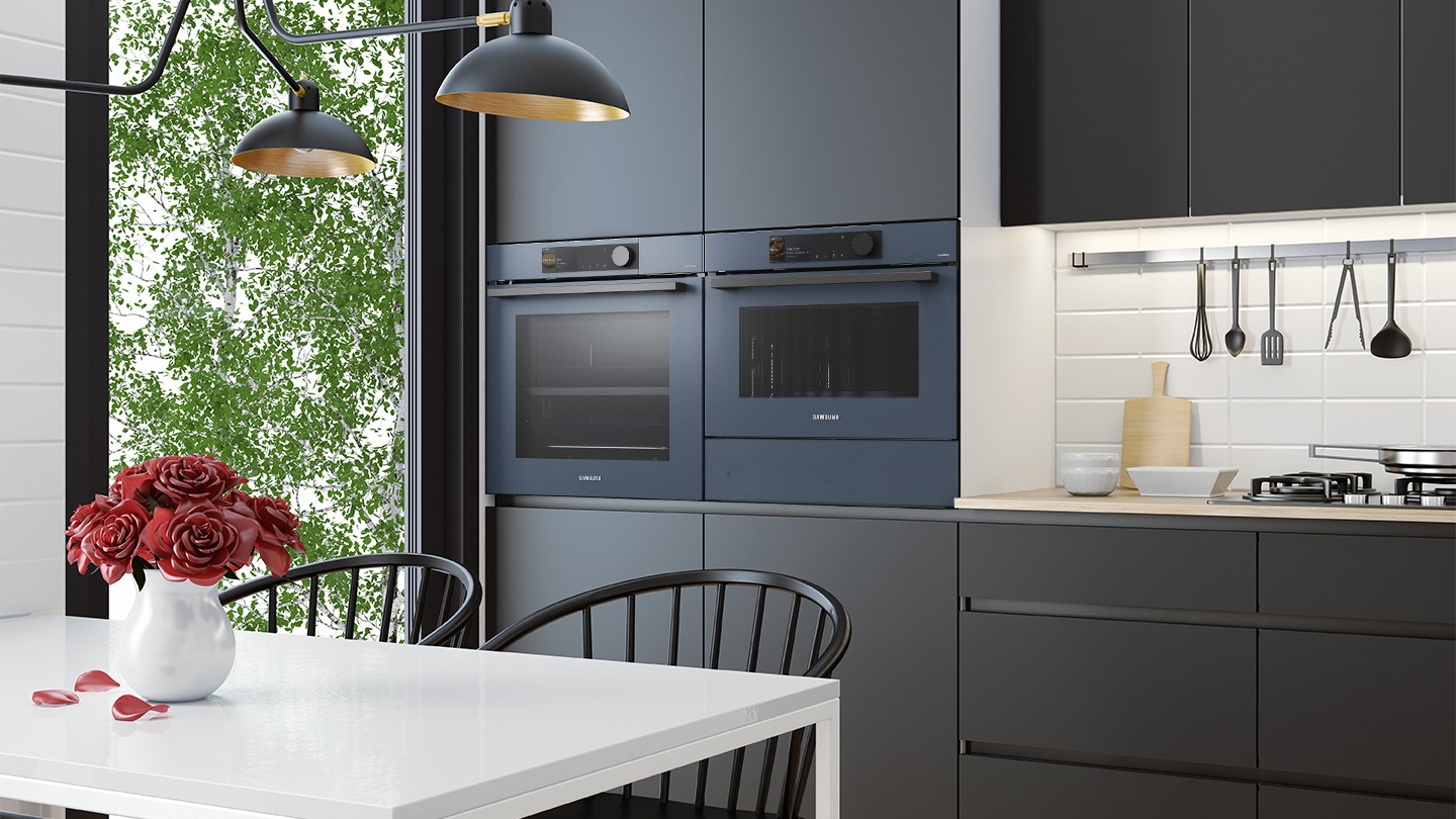 Shows the built-in oven seamlessly installed in a kitchen next to a Microwave Combo oven. Its BESPOKE "Clean Navy" color elegantly complements and enhances the kitchen's color scheme.
