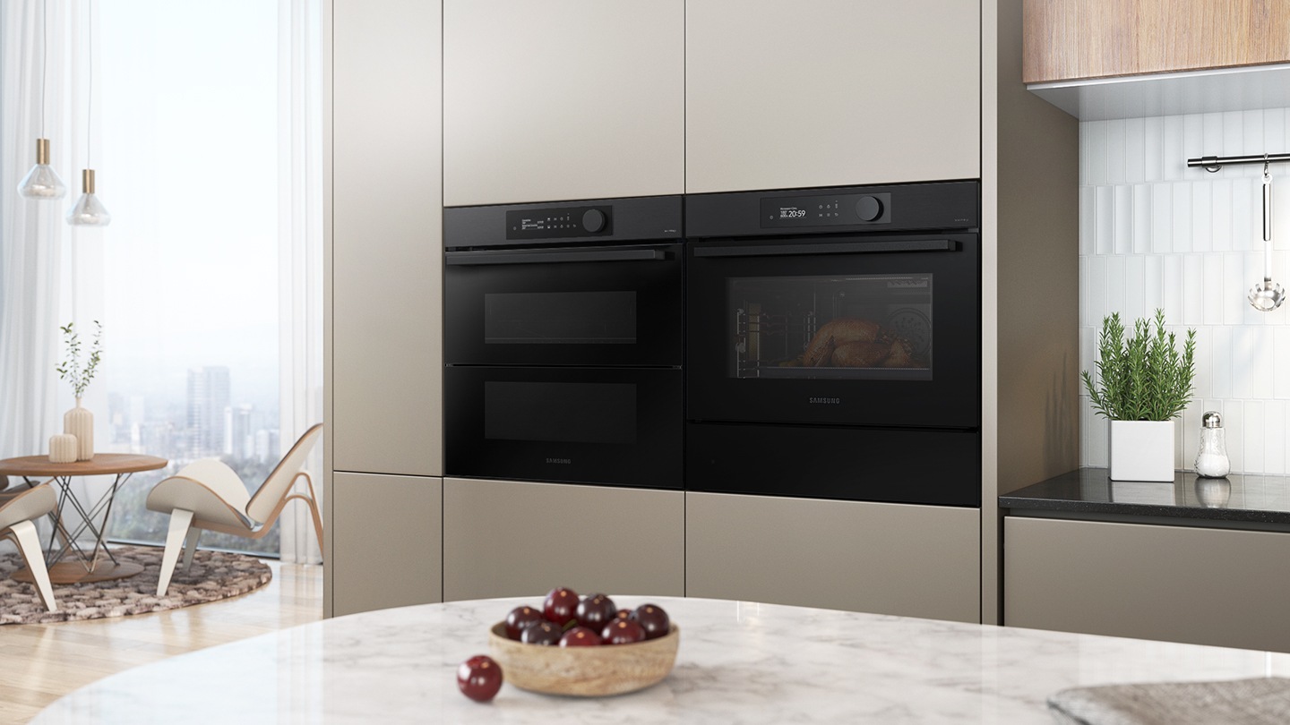 Shows the built-in oven seamlessly installed in a kitchen next to a Microwave Combi oven.