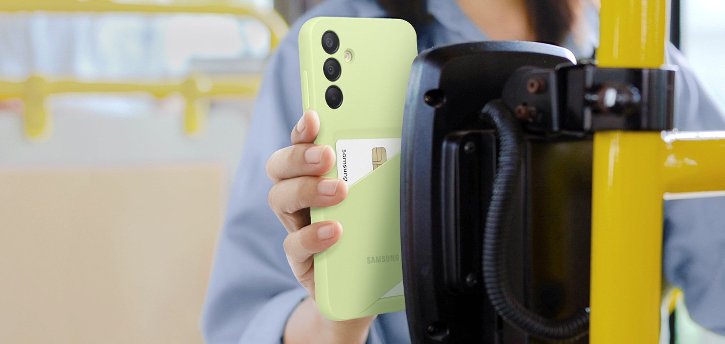 A woman is tagging her Galaxy A15 5G device wearing a Lime Card Slot Case with a card pocketed to pay for her transportation.