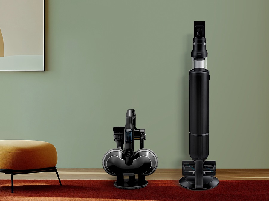 The Accessory Cradle and Clean Station are located on the left side next to the green wall and orange chair.