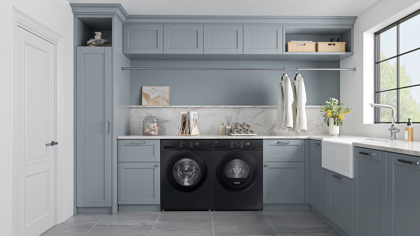 The washing machine is installed with dryer in the laundry room.