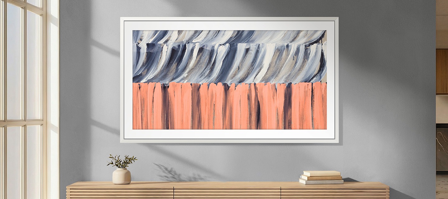 The Frame TV with Glare Free QLED displays lifelike abstract art with reduced reflections and consistent brightness in a modern interior.
