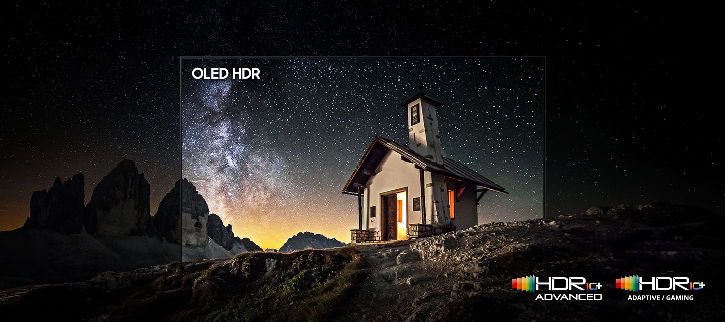 A small mountain chapel under a star-filled night sky, highlighted within an OLED HDR frame that emphasizes bright lights, deep blacks, and fine detail. HDR 10+ Advanced logo, HDR 10+ Adaptive/Gaming logo
