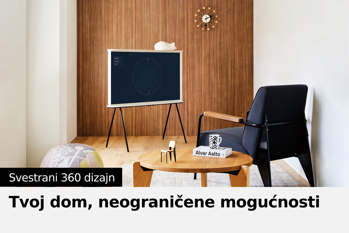 Serif televizor stoji pored stolice i stočića.