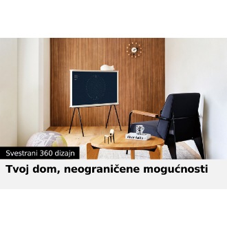 Serif televizor stoji pored stolice i stočića.