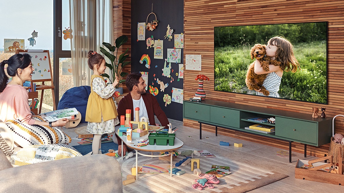 A family is watching TV.