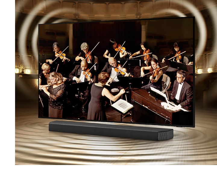 Simulated sound wave graphics from TV and soundbar demonstrate Q Symphony technology as they play sound together.