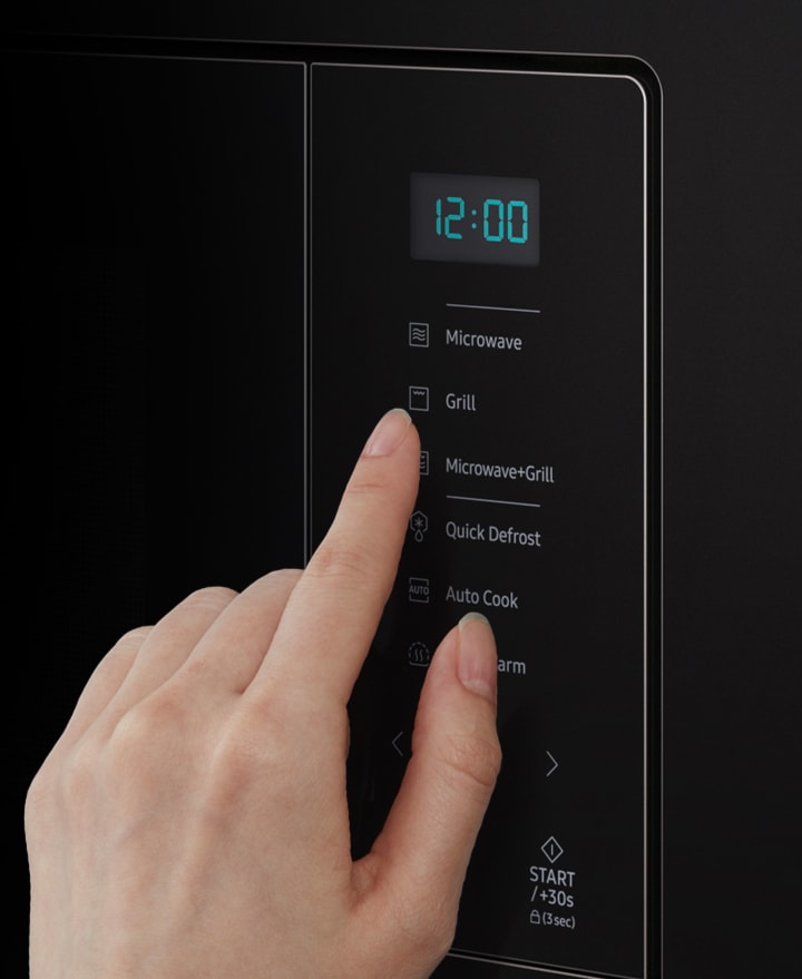 Shows someone using the 6 functions buttons of the minimalist looking Glass Touch control panel with a touch of their finger.