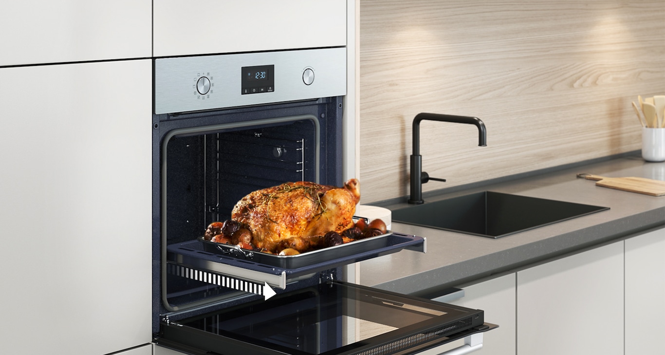 Shows a roast chicken sliding out of the oven on the Telescopic Rail.