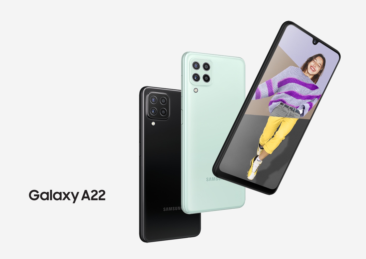 Three Galaxy A22 phones in a row. Two seen from the rear to show the rear camera and the colors black and mint. One seen from the front, and onscreen is a collage of a woman's head, a purple striped sweater and yellow pants with the word Awesome.
