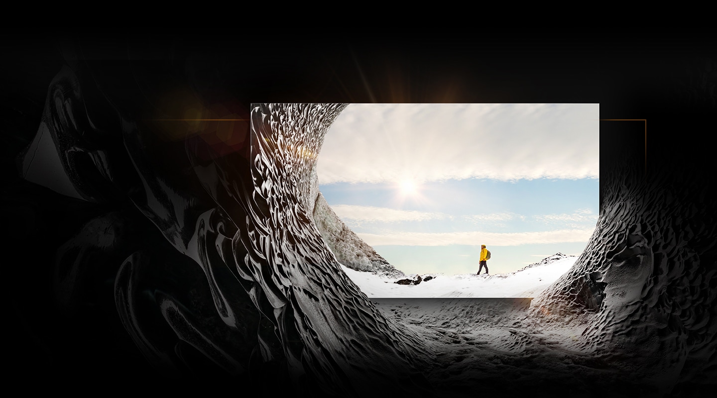 MICRO LED is placed inside a mountain cave and is displaying the image of a mountain climber in the sun. The mountain cave blends into the on-screen image to show that the textures of inside and outside the mountain cave are indistinguishable from each other.