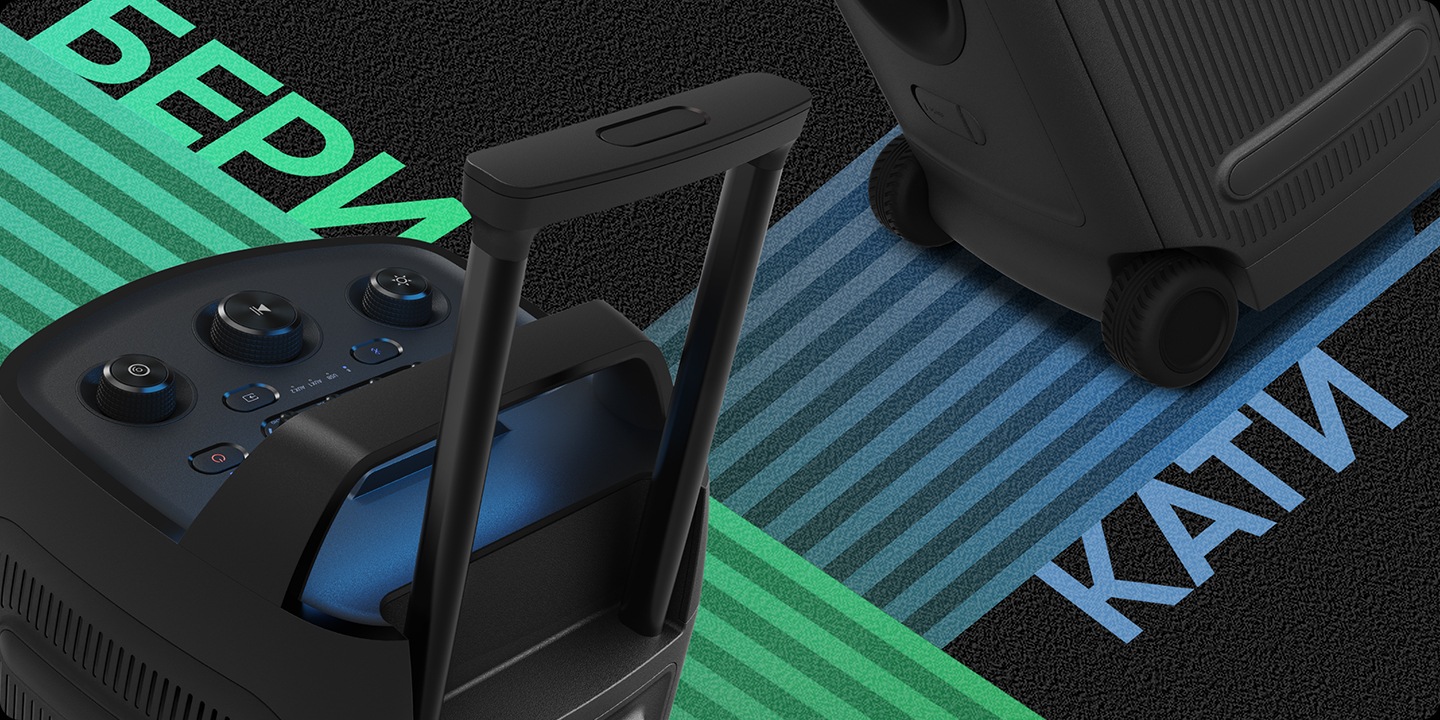 Крупный план ручки Sound Tower ST50F с надписью GRIP и встроенных колес с надписью ROLL.