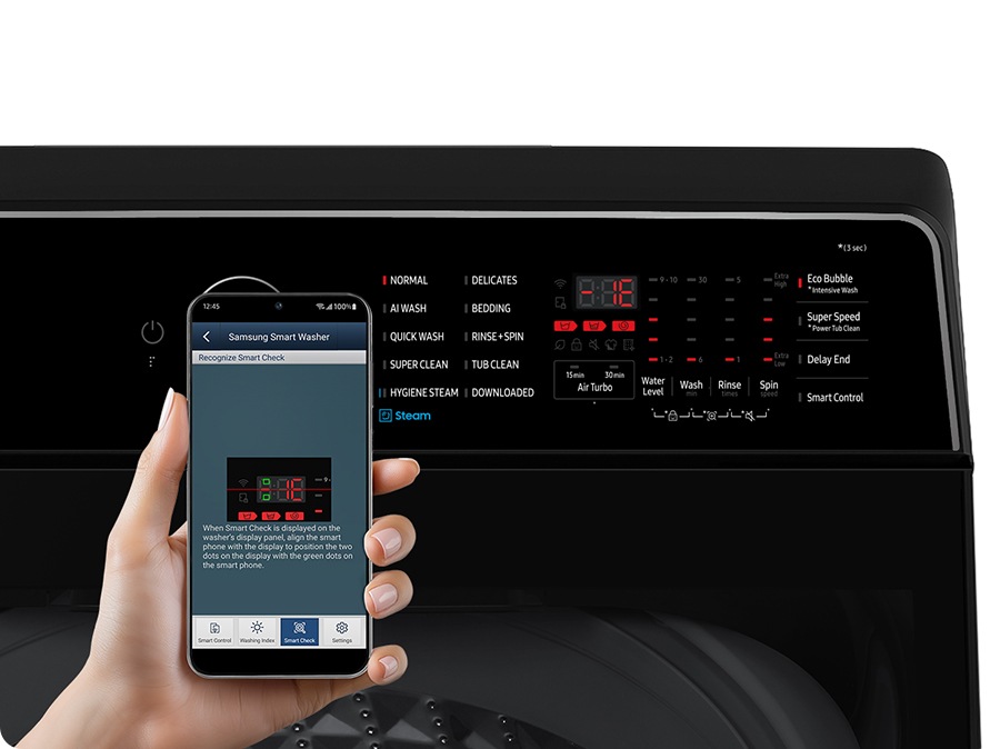 A person scans the error code that appeared on the washing machine display with the smartphone App.