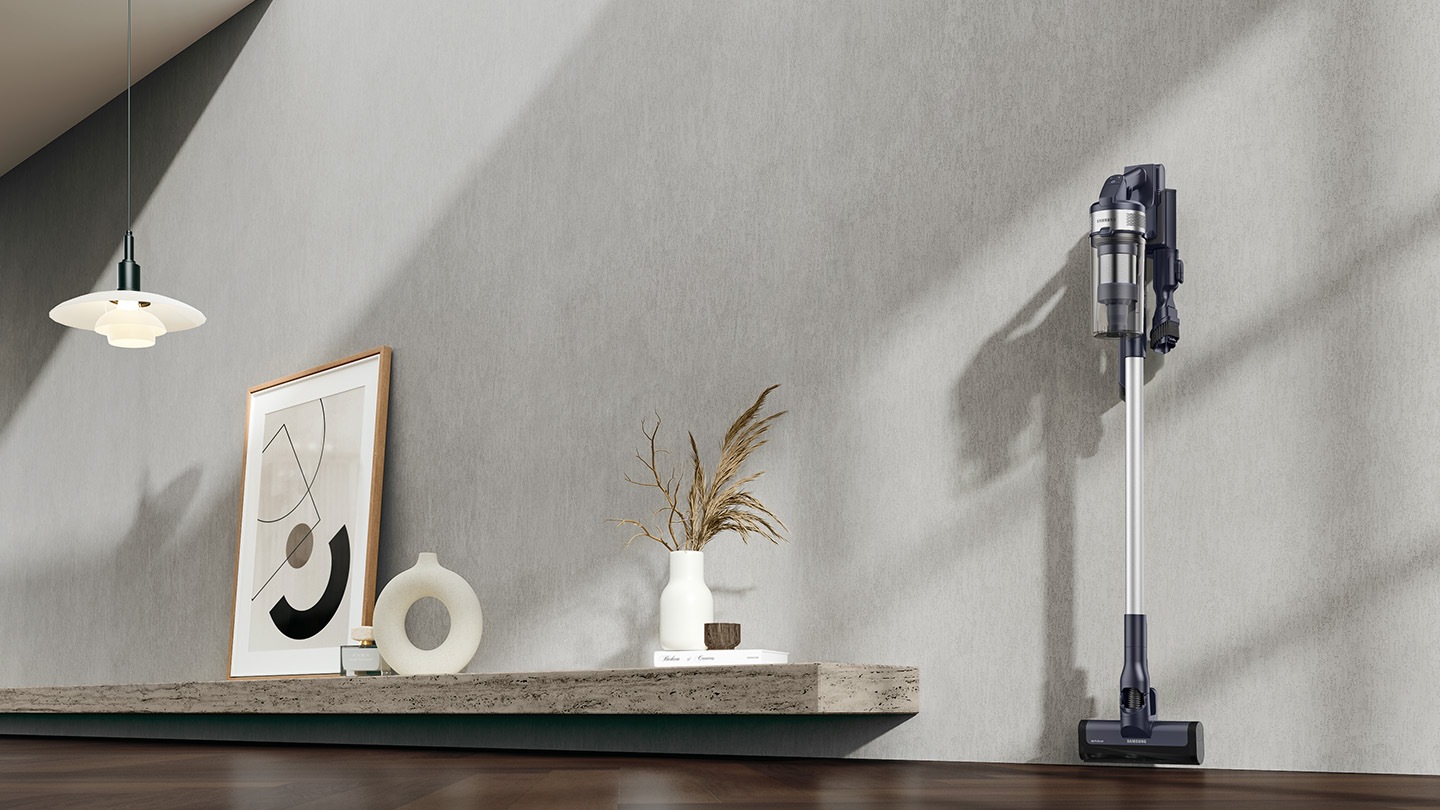 Jet 65 is placed in charging station on the wall of a modern living room.