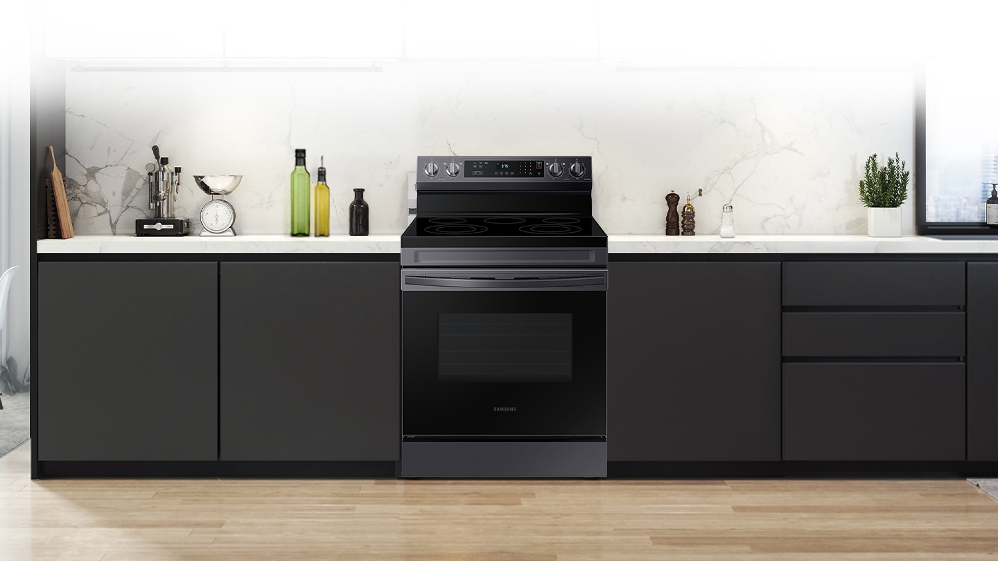 Shows a modern kitchen with the stylish, stainless steel oven fitting neatly into the design.