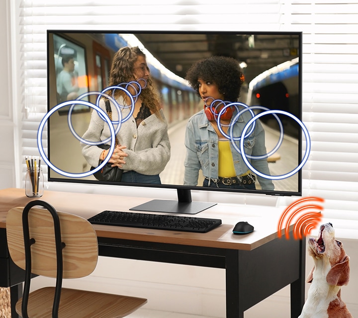 A modern monitor setup and a dog. Active Voice Amplifier enhances Dialogue sound when the dog barks.