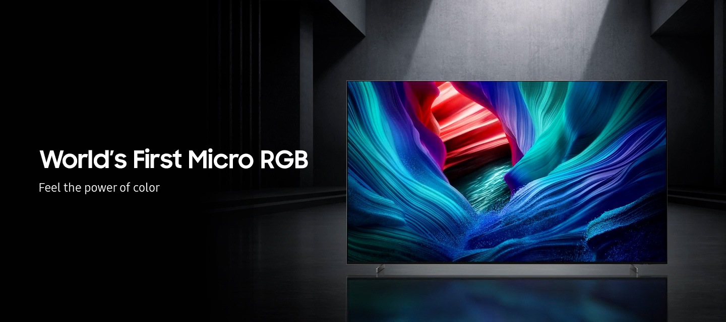 A Micro RGB TV in a gray room plays a scene with abstract colors. A caption reads 'World's 'First Micro RGB, Feel the power of color'.