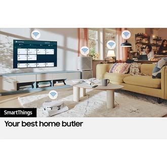 The SmartThings UI is on display on the TV. Wi-Fi icons are floating on top of the TV, vacuum robot, air purifie and lights.