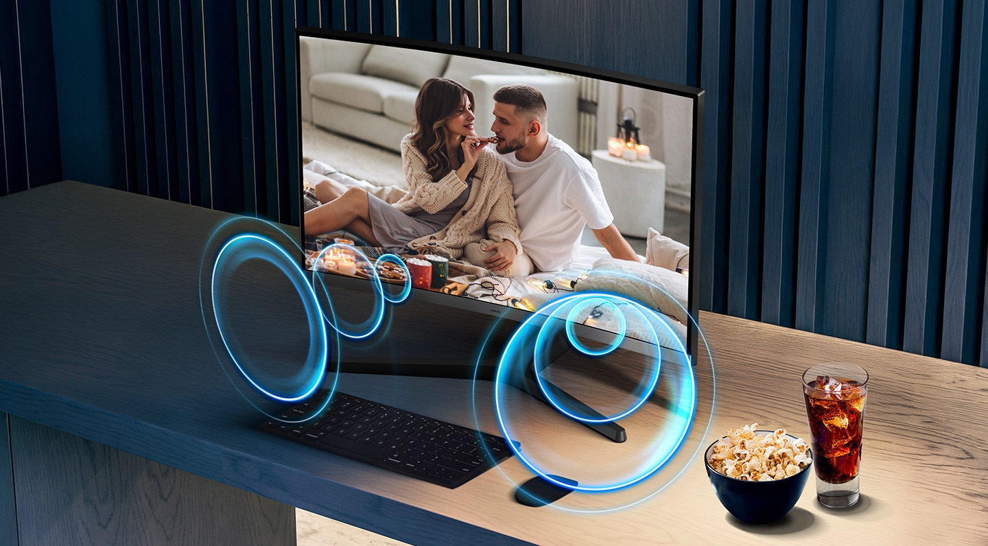 A video is being played on the monitor. Around it, there are circles that represent built-in speakers.