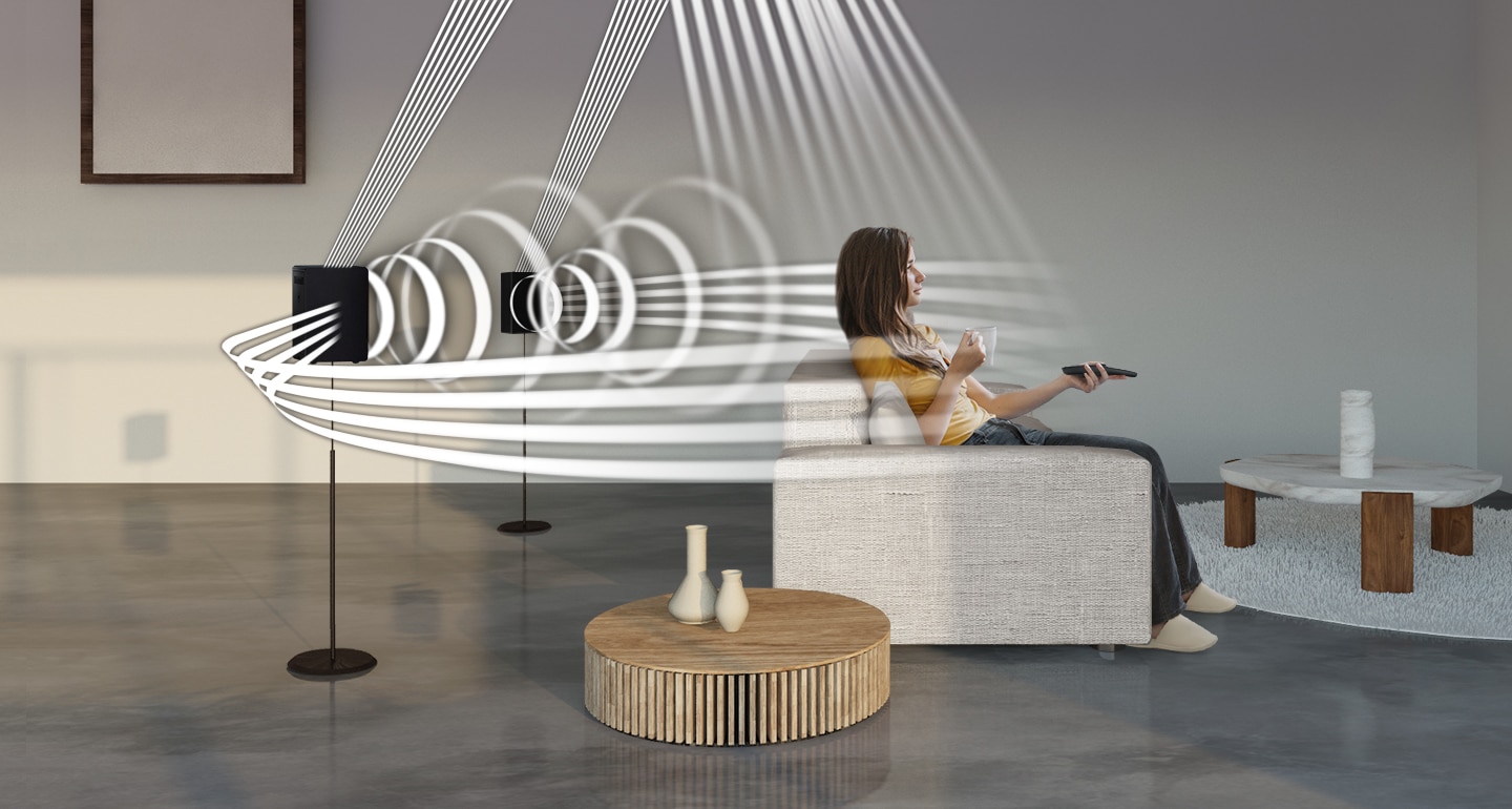 A woman enjoys TV. Soundwave graphics demonstrate Q950A wireless rear speaker's upfiring capability in addition to normal sound output direction.