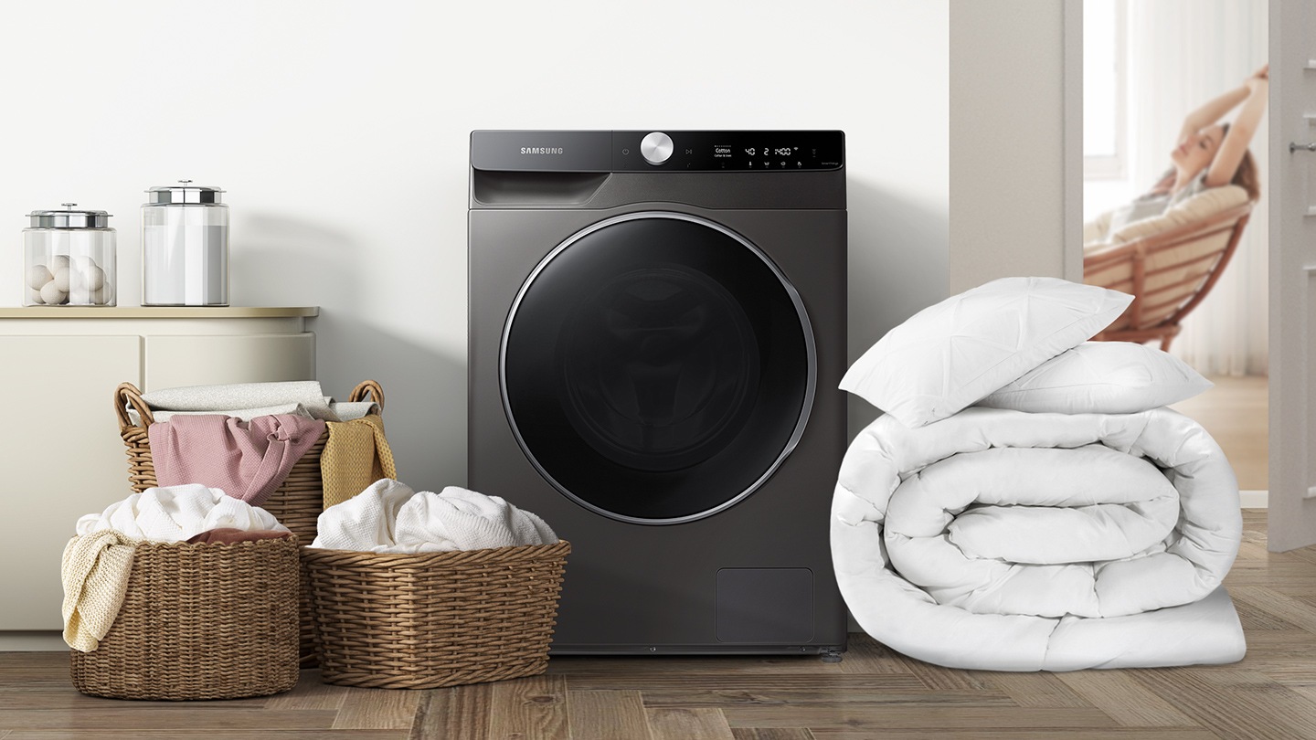 Buy WD12TP44DSX/SP now. QuickDrive™, 12Kg, Washer Dryer, 4 Ticks seen with folded duvet and baskets of fresh laundry