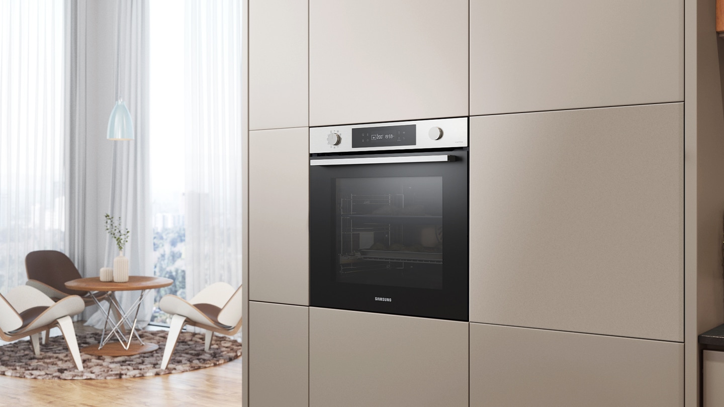 Shows the built-in oven installed in a kitchen, with two cooking zones and a hinged door, next to a Microwave Combi oven.