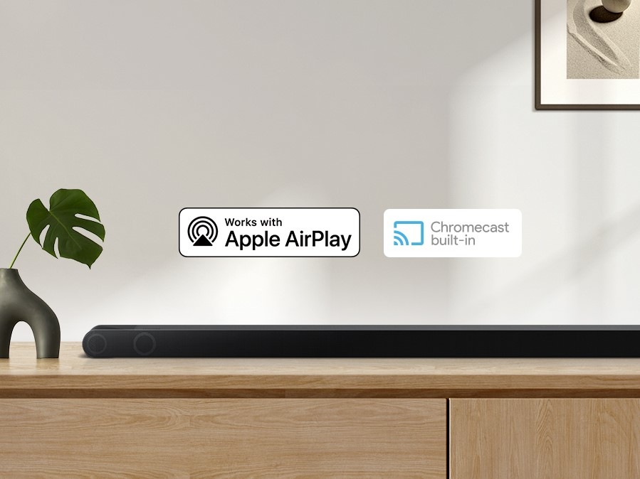 Alexa logo and Apple AirPlay logo can be seen along with Samsung S800B soundbar which is sitting on living room cabinet.