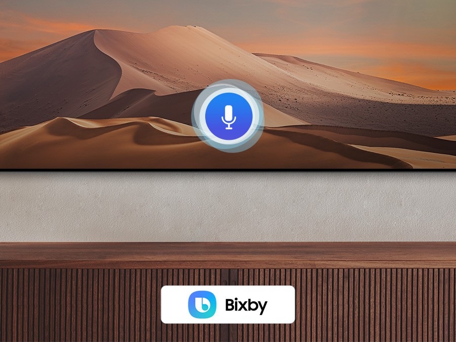 A microphone icon overlays an image, demonstrating voice assistant feature. The Bixby, Alexa built-in and the Hey Google logos are on display on the bottom.