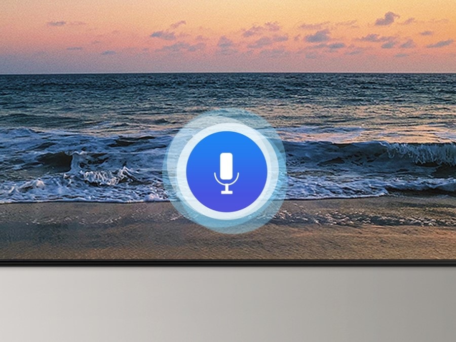 A microphone icon overlays an image, demonstrating voice assistant feature. The Bixby, Alexa built-in and the OK Google logos are on display on the bottom.