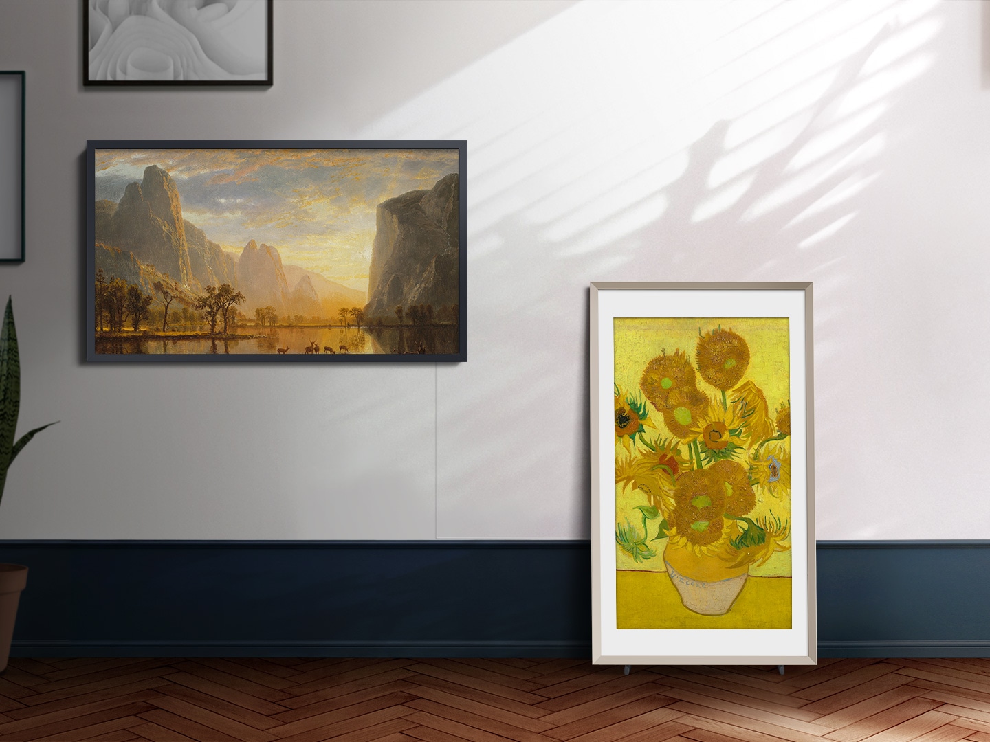 An artwork is on display on The Frame which looks like a picture frame next to other pictures on the wall.