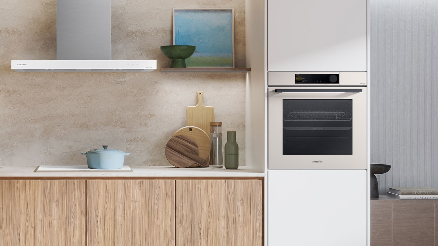 Shows the built-in oven installed in a kitchen, with two cooking zones and a hinged door, next to a Microwave Combi oven.