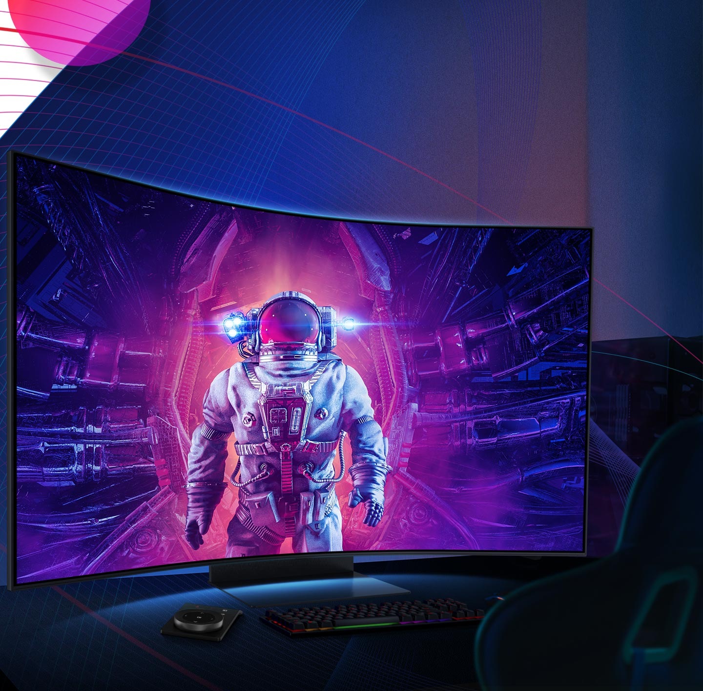 An astronaut in a spacesuit is standing in the middle with purple and pink light radiating around him on the monitor screen. Beneath the monitor is a keyboard, trackpad, Ark Dial and gaming chair.