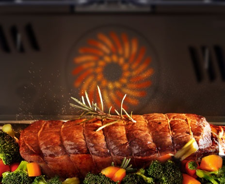 Shows the built-in oven seamlessly installed in a kitchen next to a Microwave Combo oven. Its BESPOKE "Black Glass" color elegantly complements and enhances the kitchen's color scheme.