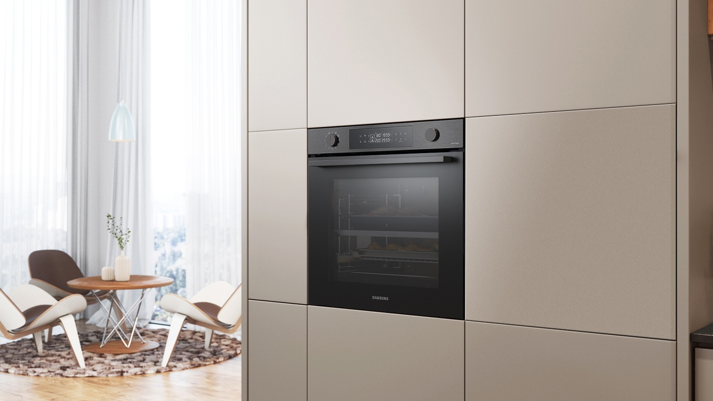 Shows the built-in oven installed in a kitchen, with two cooking zones and a hinged door, next to a Microwave Combi oven.