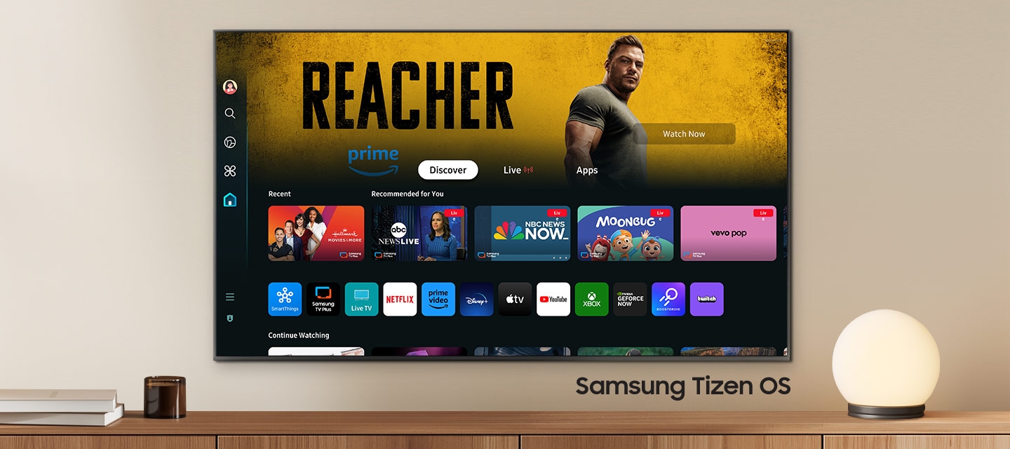 A wall-mounted TV shows popular apps and curated content on the home menu. "Samsung Tizen OS"